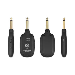 Set of black wireless guitar transmitter and receiver with gold connectors on a white background