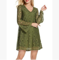Green lace dress worn by a model on a white background