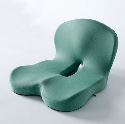 Green cushion with unique design on a white background