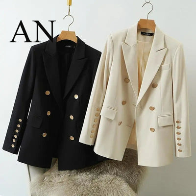 Black and white blazers on hangers with 'AN' branding.