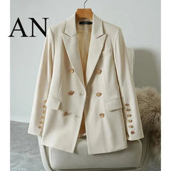 Beige blazer on a chair with a plain background