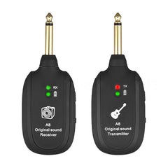 Black wireless guitar transmitter and receiver set on a white background