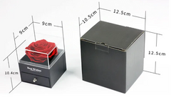 Black gift box with a red rose and dimensions labeled