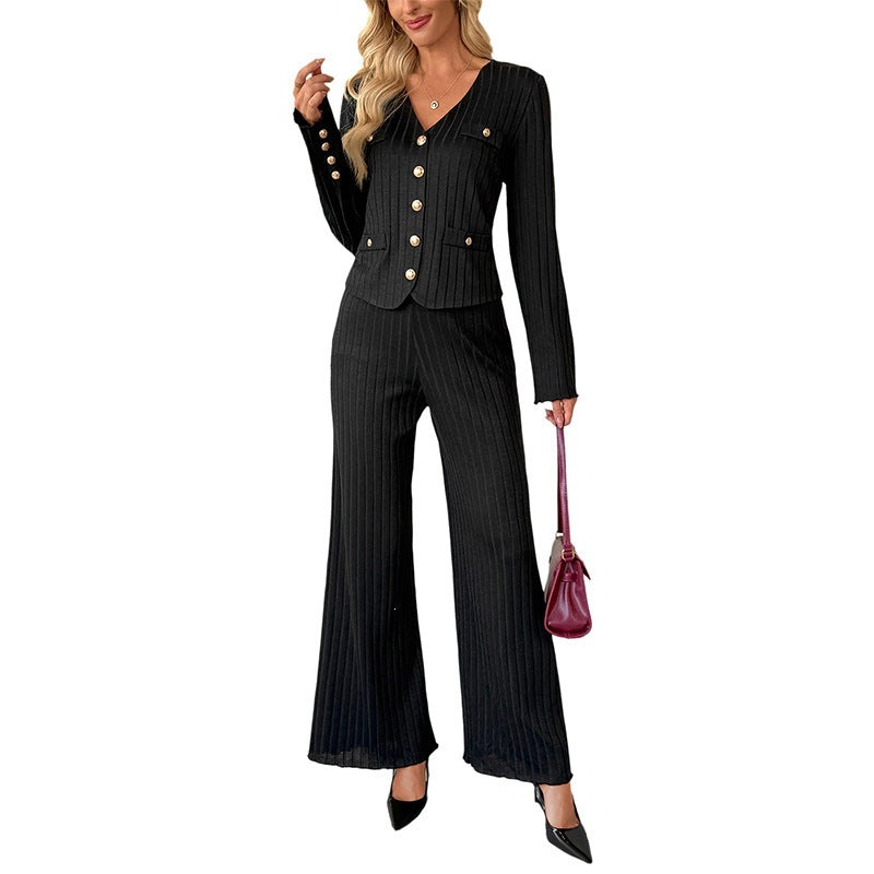 Woman wearing a black ribbed button-front top with matching wide-leg pants