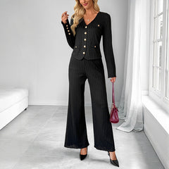 Woman wearing a black ribbed button-front top with matching wide-leg pants