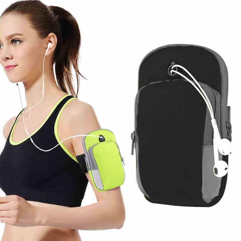 Woman wearing a green arm band with earphones, next to a black and gray armband.