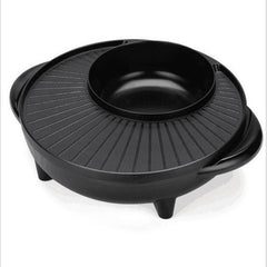 Black round grill with lid on a white background