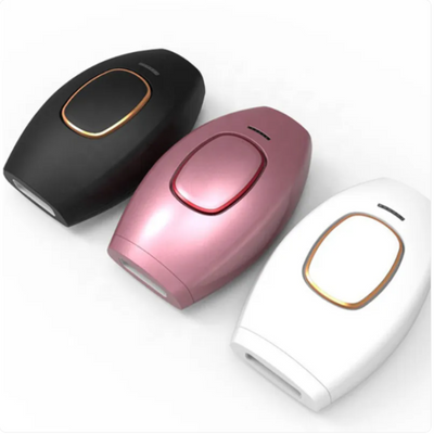 Three electronic devices in black, pink, and white on a white background